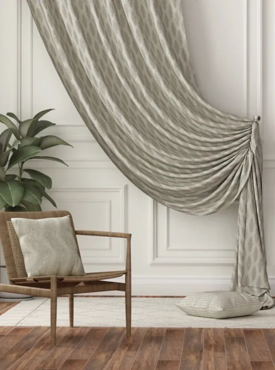Leaf-print curtain draped to one side